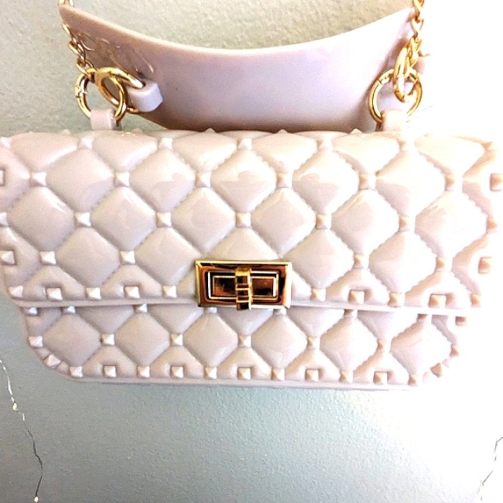 Jelly Bag- quilted crossbody purse in blush with gold crossbody chain.
